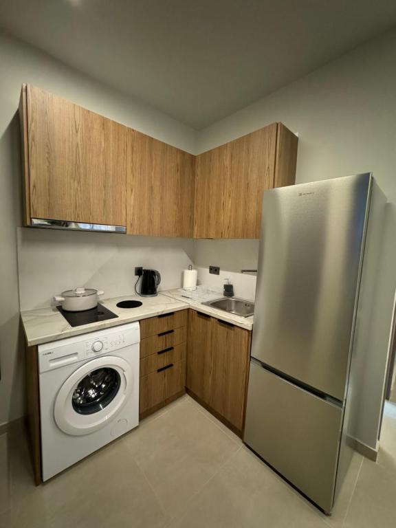 Kuchyň nebo kuchyňský kout v ubytování Baja Suites
