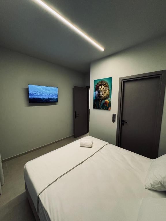 Postel nebo postele na pokoji v ubytování Baja Suites