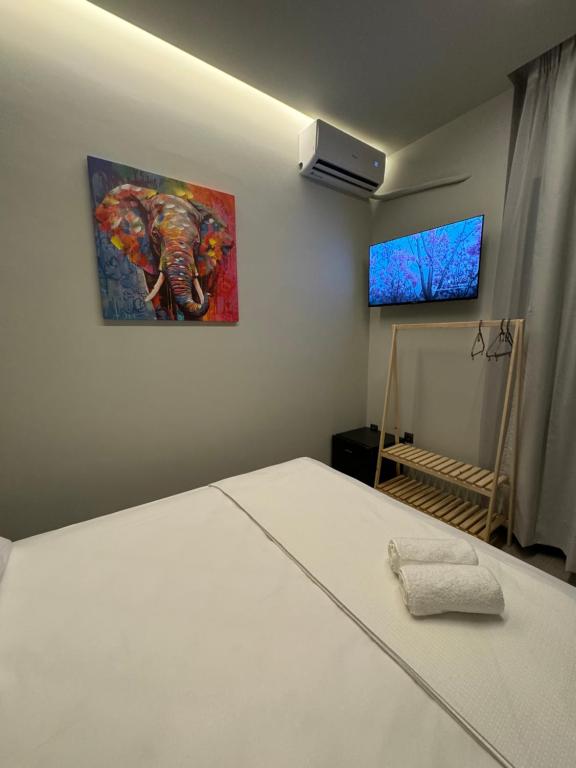 Postel nebo postele na pokoji v ubytování Baja Suites