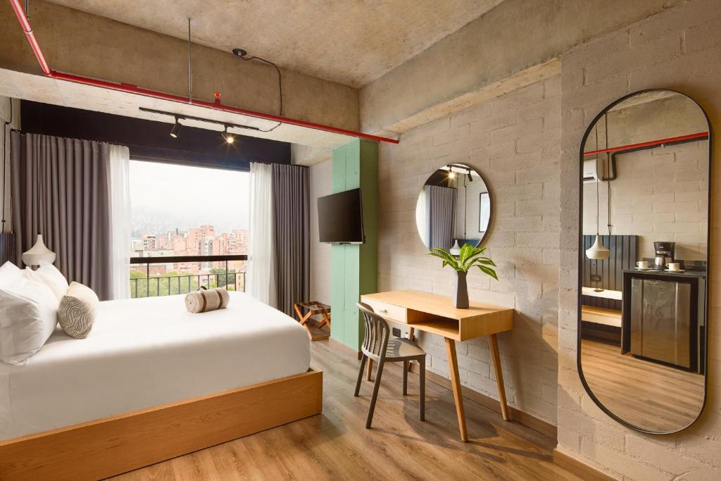 Postel nebo postele na pokoji v ubytování Urbit Social Lofts