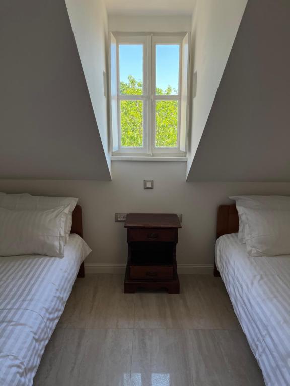 Postel nebo postele na pokoji v ubytování Franciscan Rooms, Dubrovnik Old Town