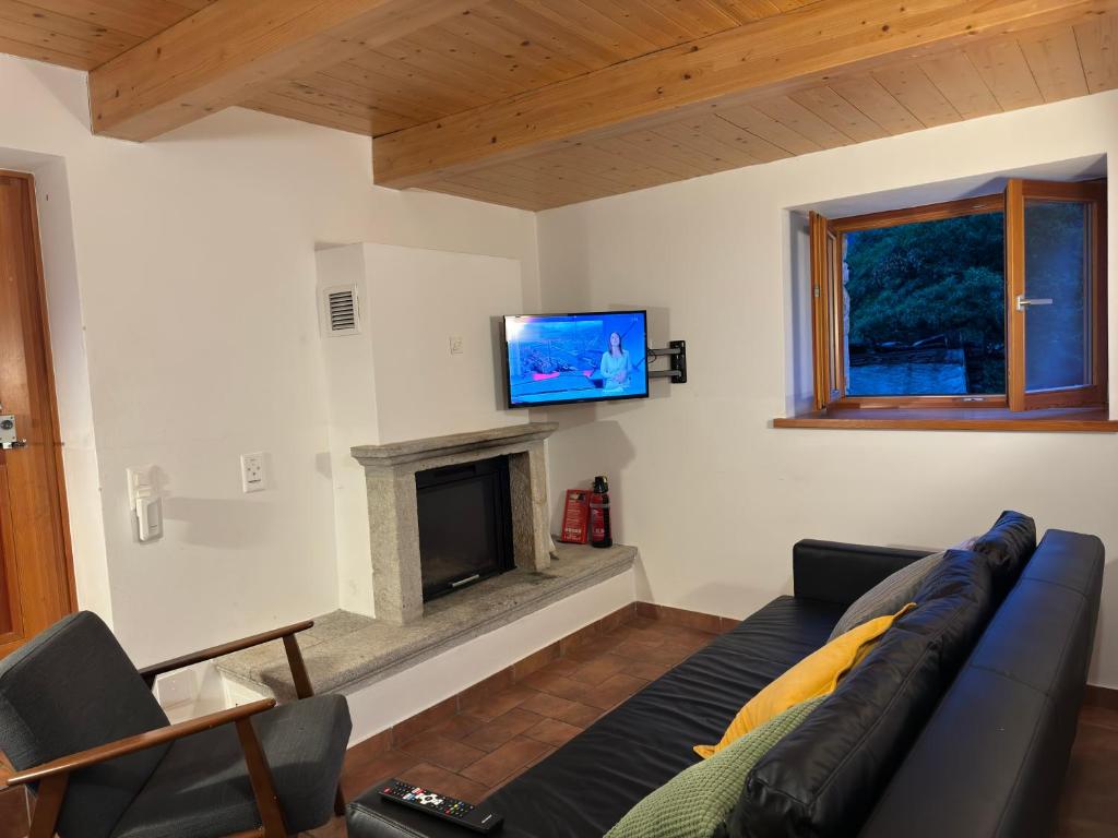 TV a/nebo společenská místnost v ubytování Rustici Maggia