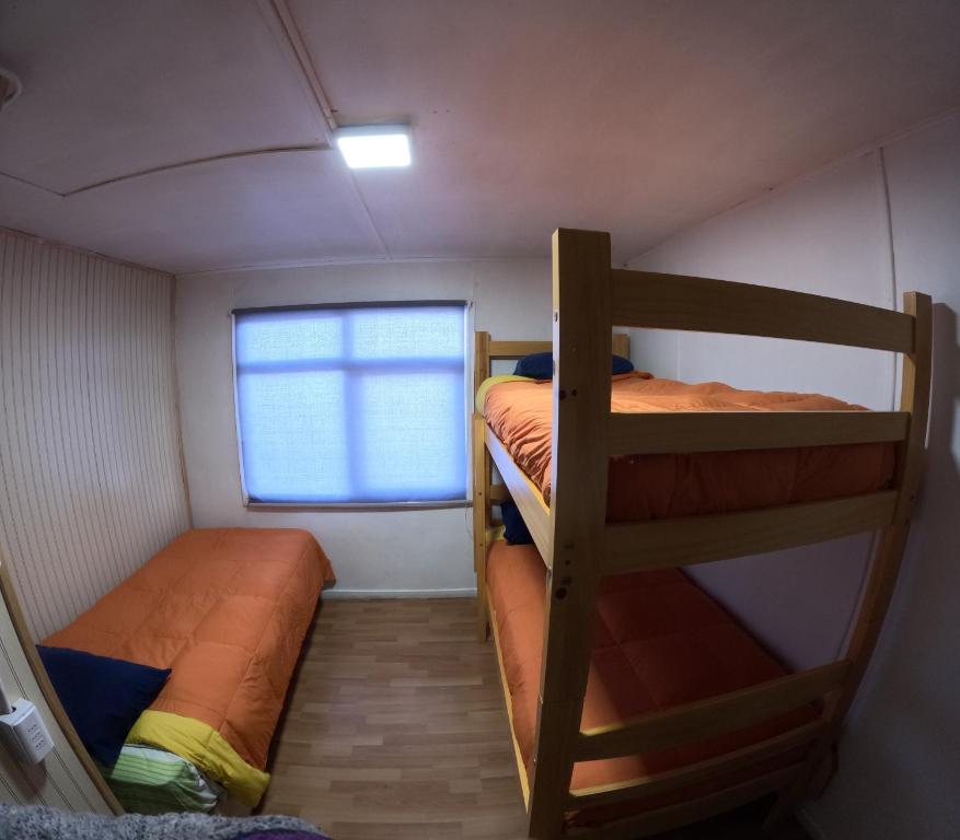 Postel nebo postele na pokoji v ubytování Hostel 53 Sur
