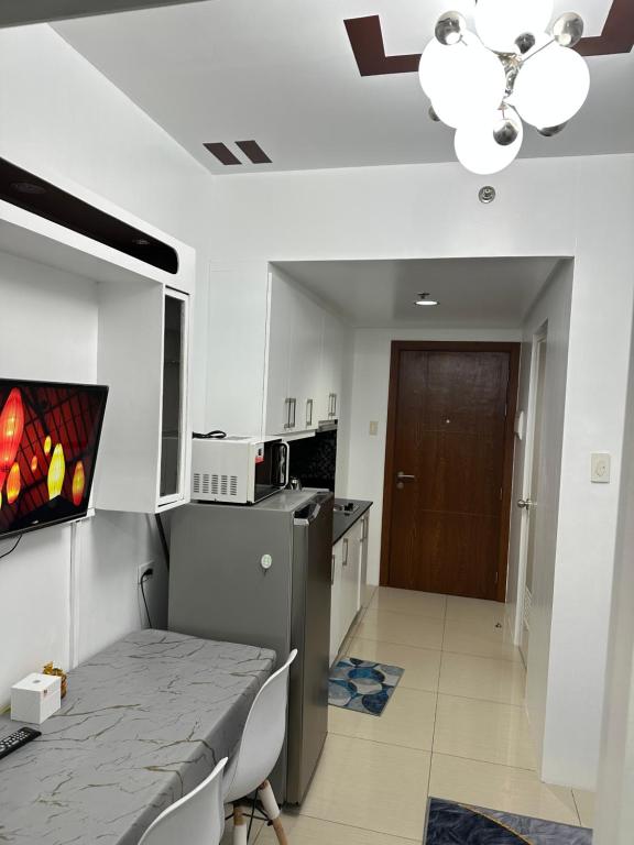 TV a/nebo společenská místnost v ubytování Shell Residences Staycation
