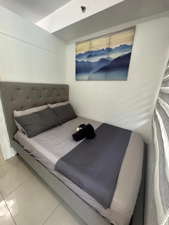 Postel nebo postele na pokoji v ubytování Shell Residences Staycation