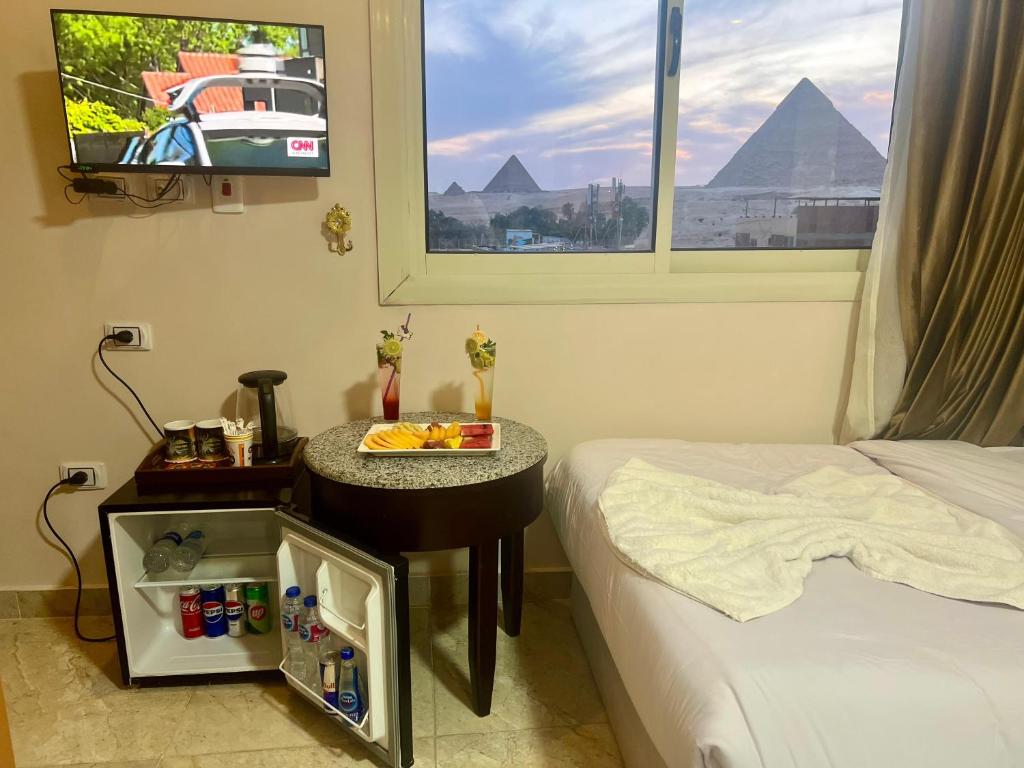 Postel nebo postele na pokoji v ubytování Nun Pyramids INN