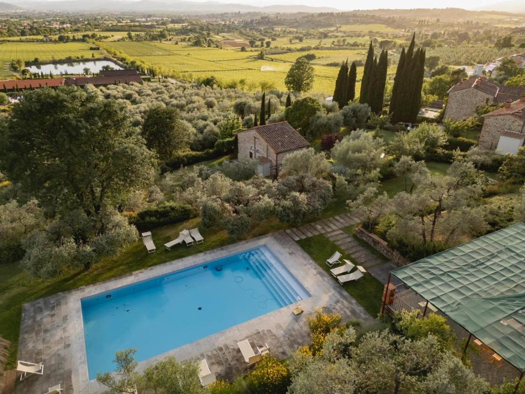an aerial view of a villa with a swimming pool at Il Palazzo - Agriturismo, Winery in Arezzo