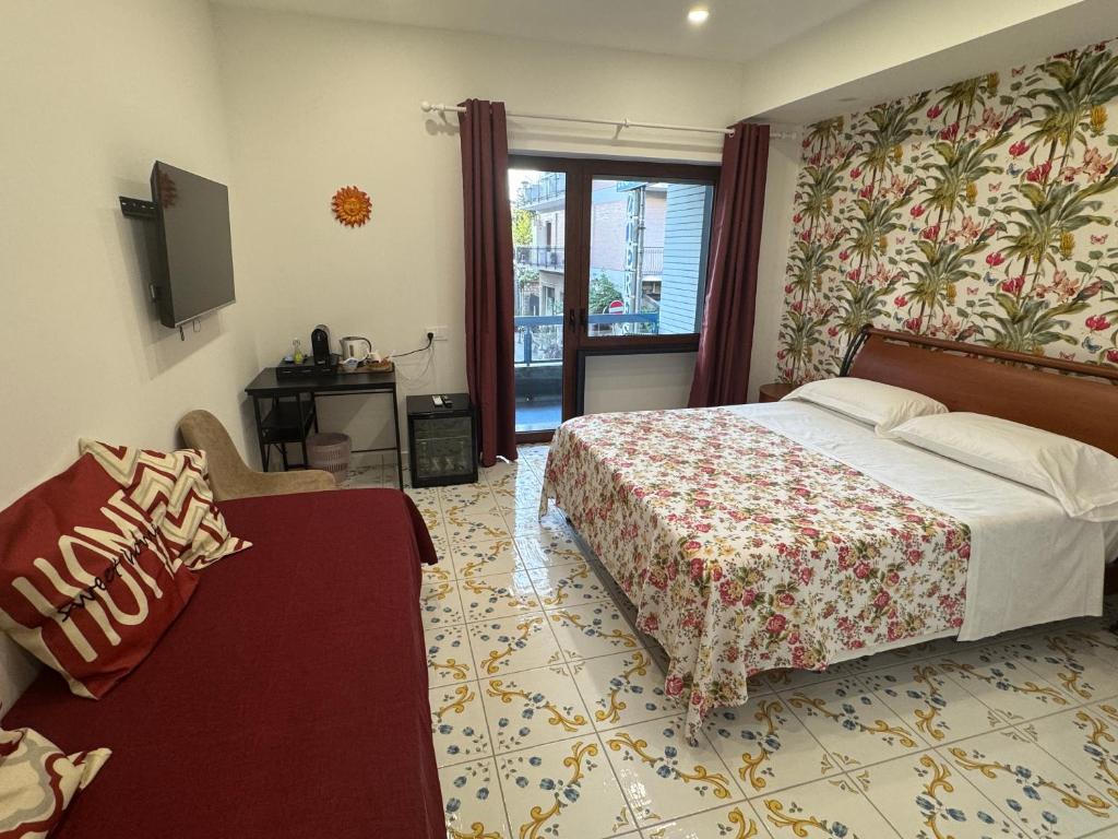 Postel nebo postele na pokoji v ubytování Angela House Sorrento Center