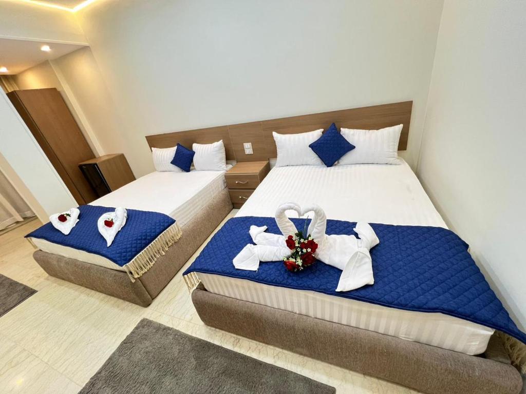 Postel nebo postele na pokoji v ubytování Town Hotel Cairo