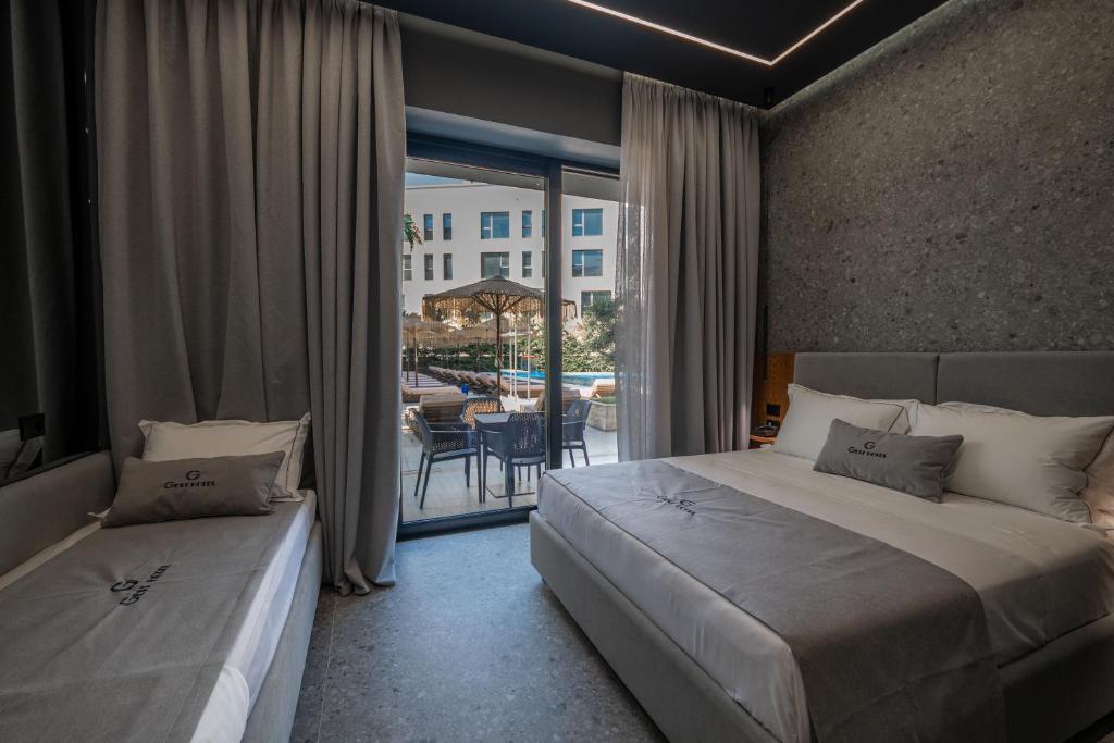 Postel nebo postele na pokoji v ubytování Gest Hotel