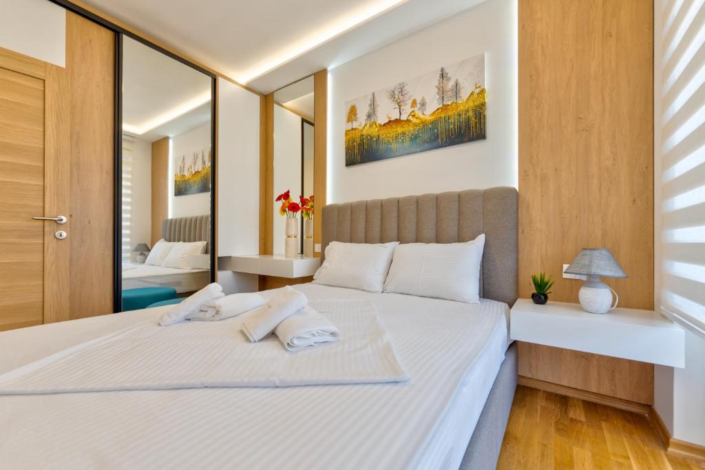 Postel nebo postele na pokoji v ubytování VIP Bogić Apartmani - Recepcija