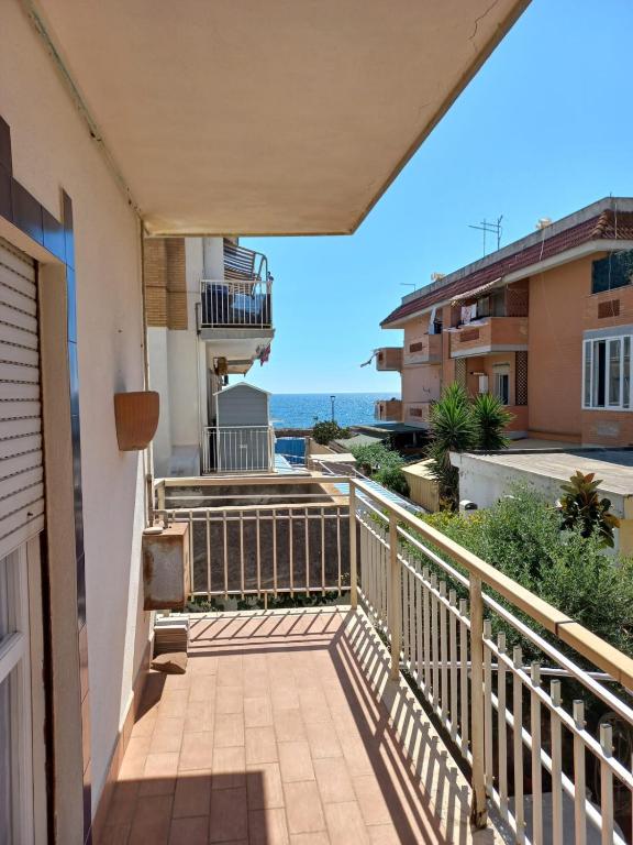 a balcony with a view of the ocean at Residenza Marina in Ladispoli