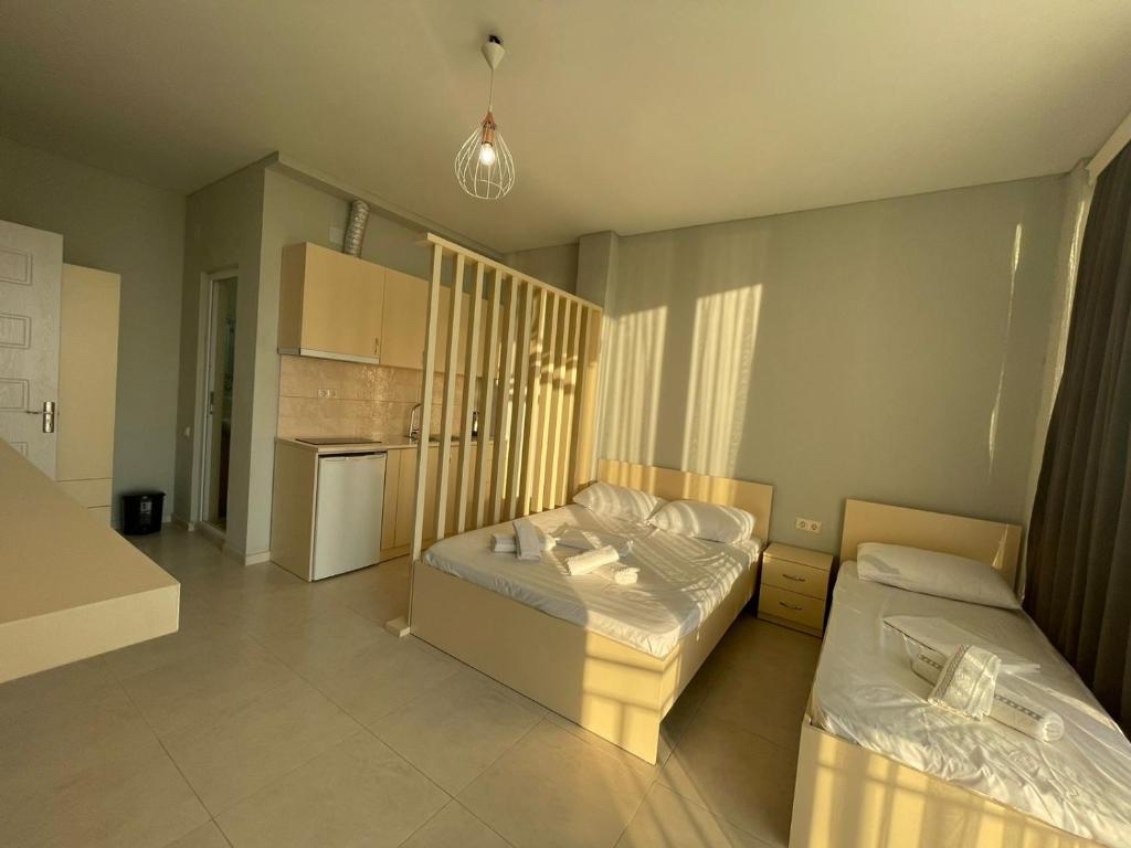 Postel nebo postele na pokoji v ubytování Hotel Nikolas