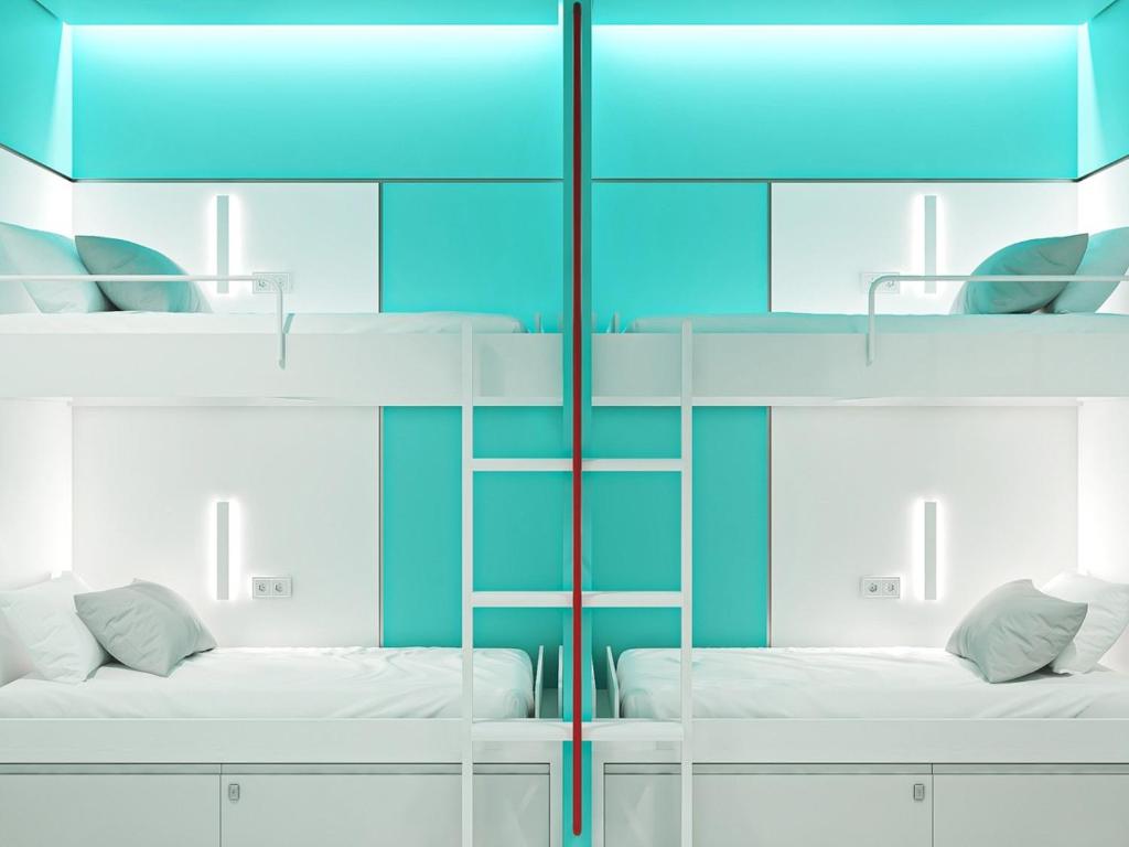 Postel nebo postele na pokoji v ubytování Cocoon City Hostel