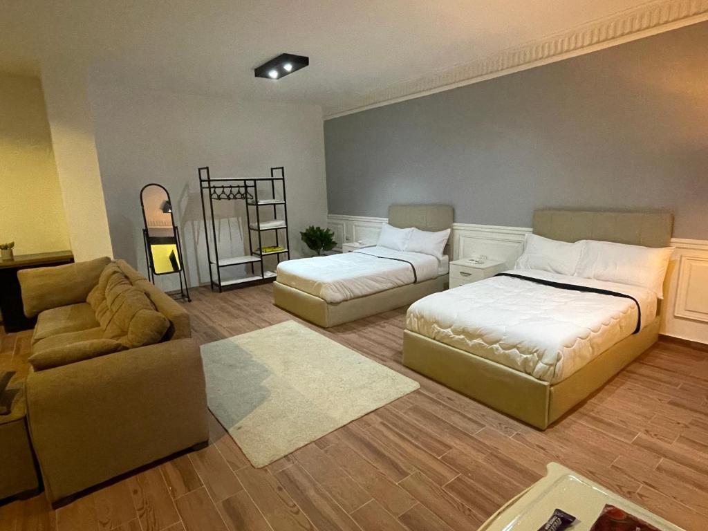 Postel nebo postele na pokoji v ubytování Rove Residence New Cairo