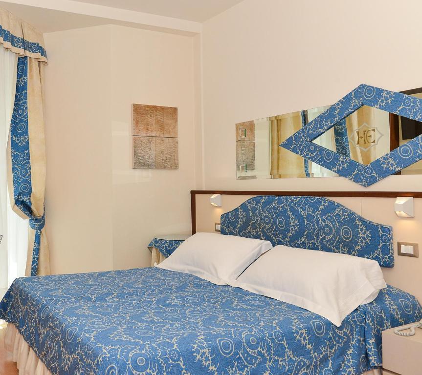 Postel nebo postele na pokoji v ubytování Hotel Elite