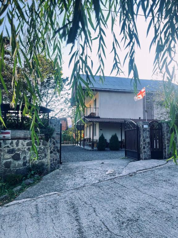 a building with a gate in front of it at Guest House on Meskheti in Borjomi