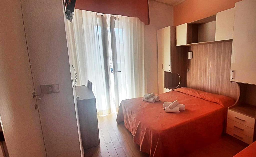 Postel nebo postele na pokoji v ubytování Hotel Sara