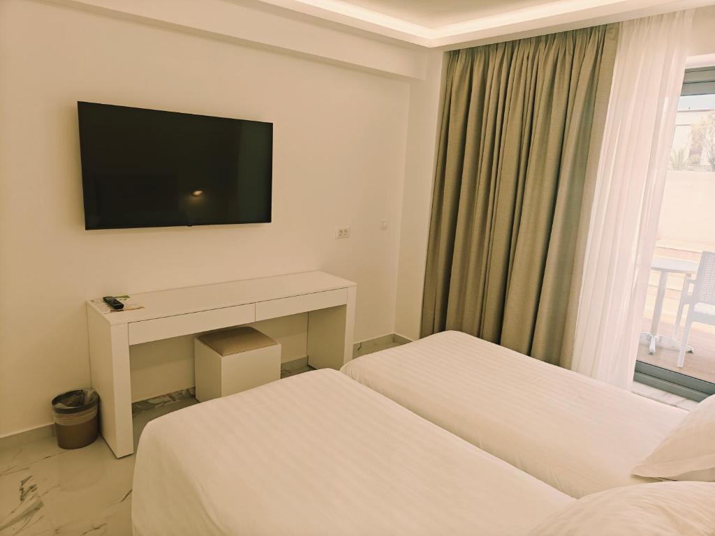 Postel nebo postele na pokoji v ubytování Ibiscus Hotel