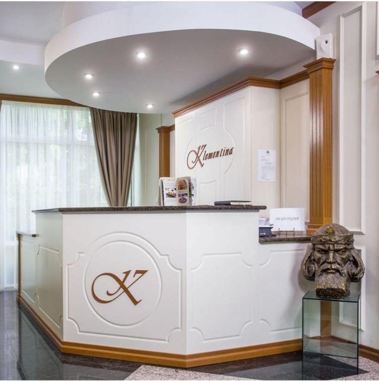 a salon with a counter with a x sign on it at Парк-Хотел Клементина in Trud