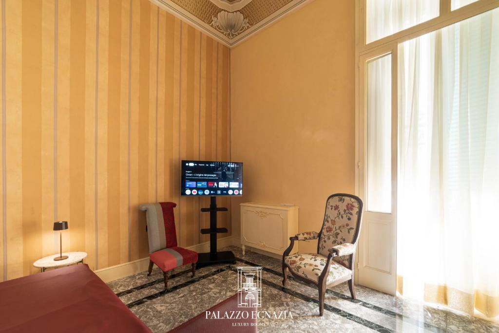 TV a/nebo společenská místnost v ubytování Palazzo Egnazia Fasano