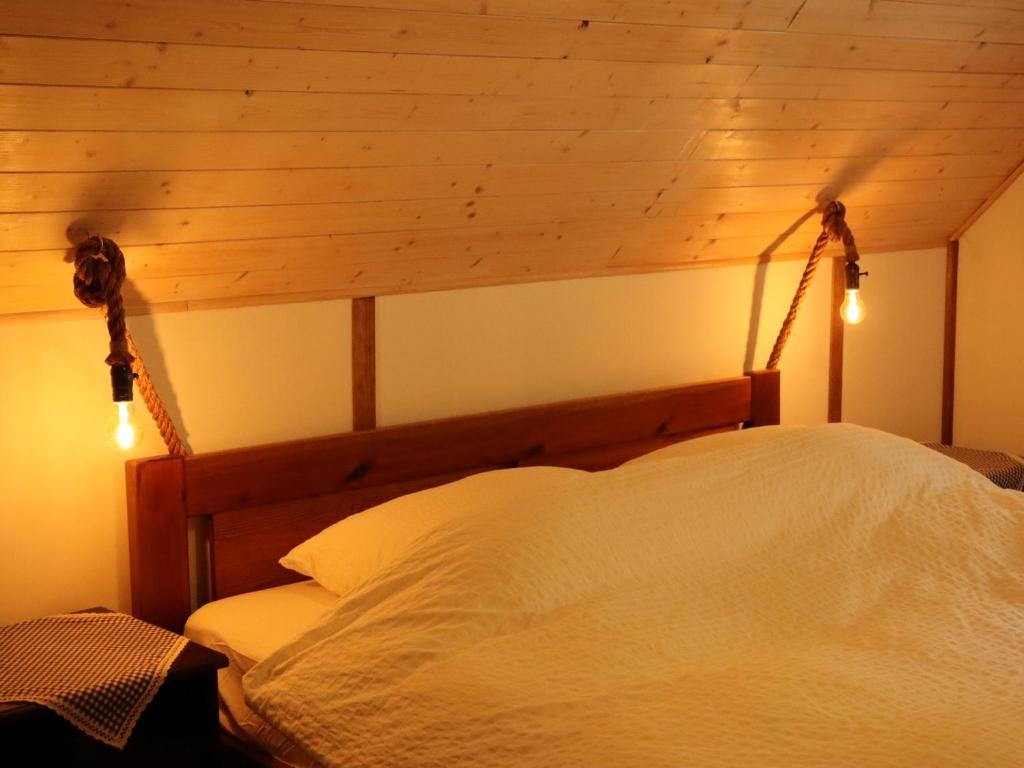 Postel nebo postele na pokoji v ubytování Hlučov Lesní Chalupa