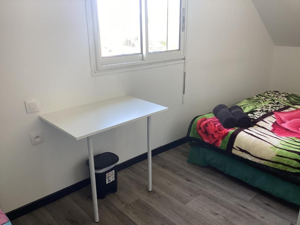 Postel nebo postele na pokoji v ubytování LES AGAPANTHES du 27 -ème