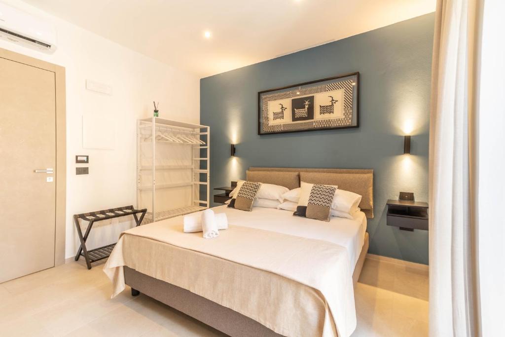 Rúm í herbergi á Sardinian Days - Suites & Rooms