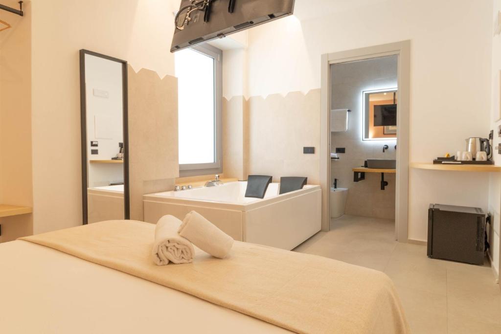 Rúm í herbergi á Sardinian Days - Suites & Rooms
