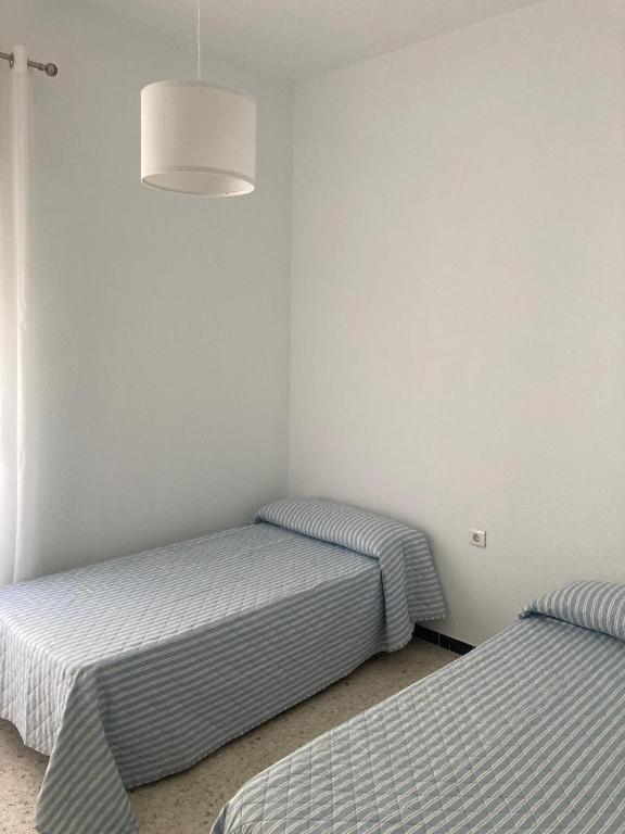 Postel nebo postele na pokoji v ubytování Piso céntrico en Moguer