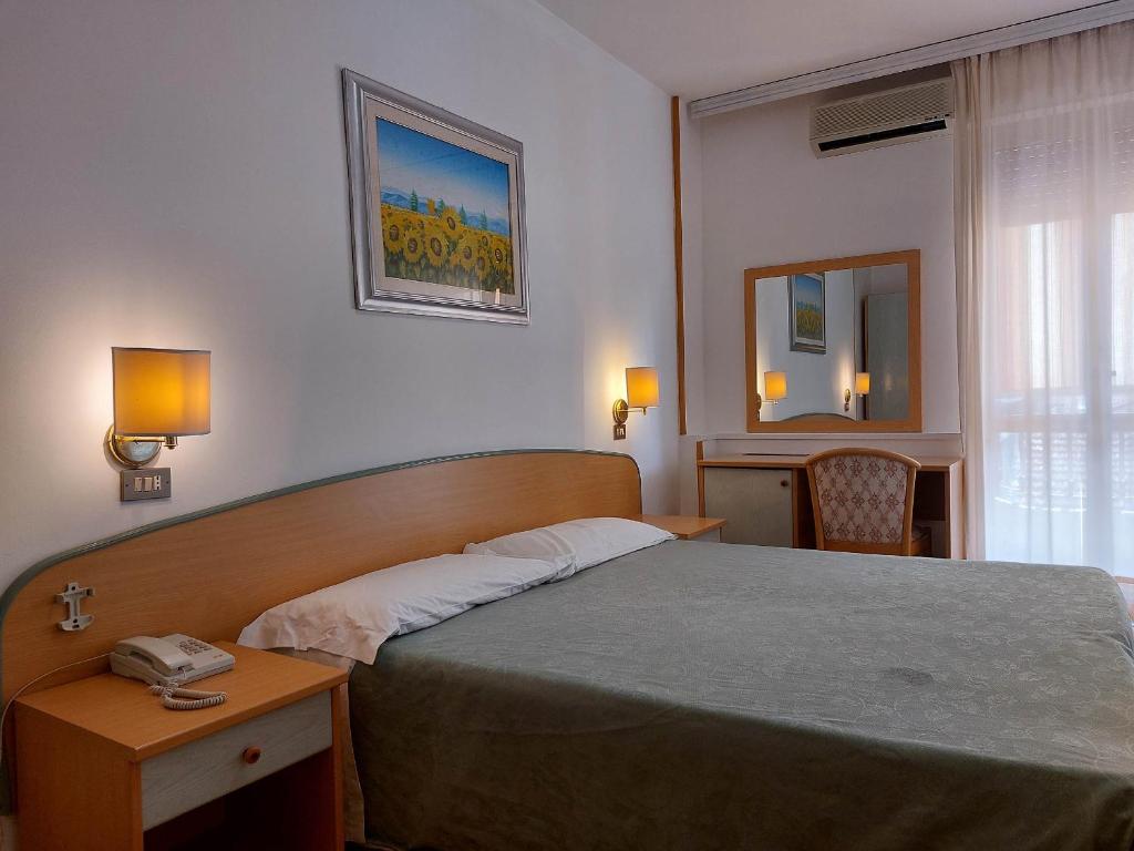 Postel nebo postele na pokoji v ubytování Hotel Nettuno