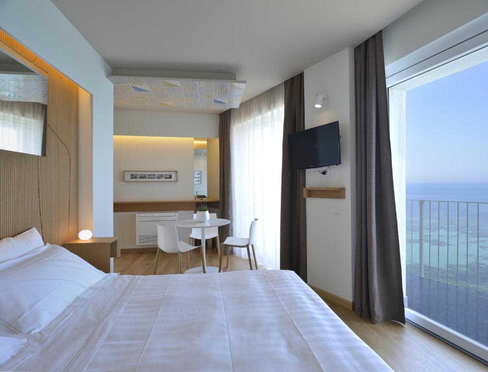 Łóżko lub łóżka w pokoju w obiekcie Gaura Apartments