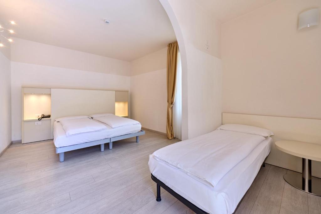 Postel nebo postele na pokoji v ubytování Hotel Geier