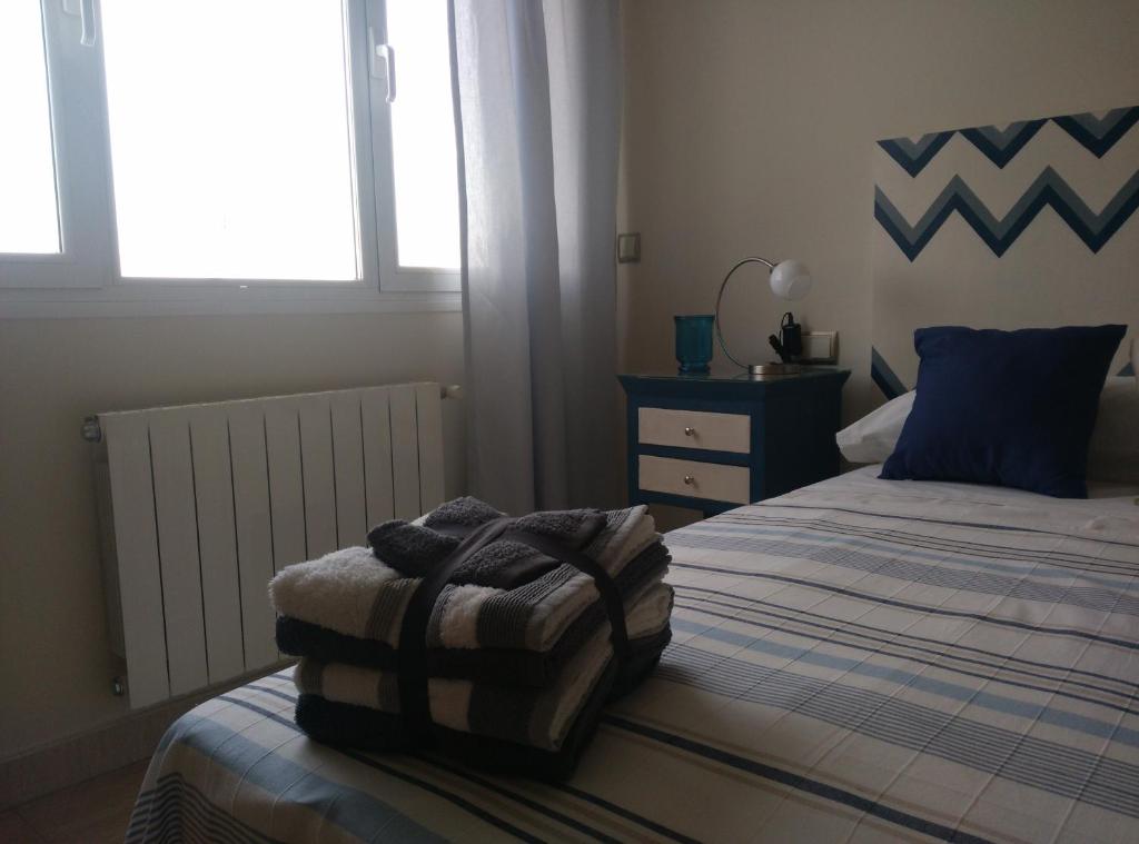 Postel nebo postele na pokoji v ubytování Centro Excelente situación Ático lujo con parking gratuito