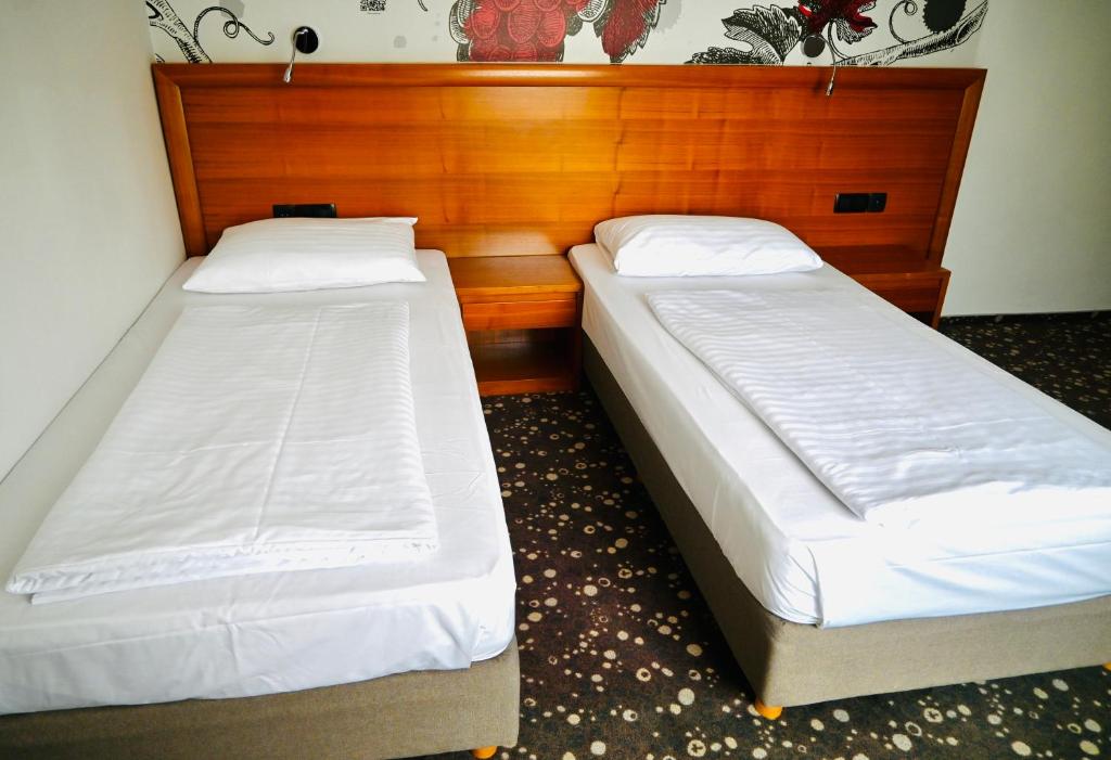 Postel nebo postele na pokoji v ubytování Hotel Piramida