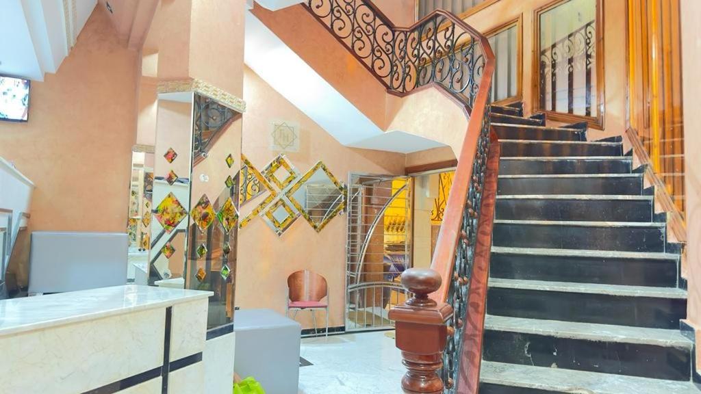 a spiral staircase in a home with a lobby at HOTEL FADOUA in Moulay Yacoub