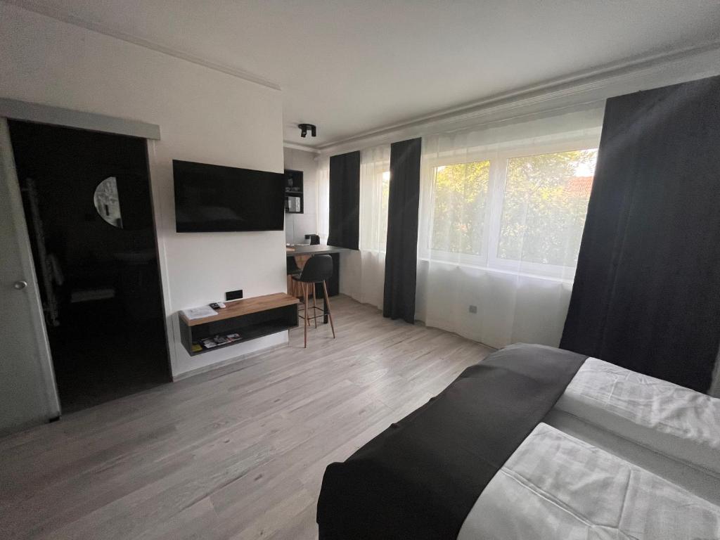 Postel nebo postele na pokoji v ubytování Várkapu Apartmanok 2
