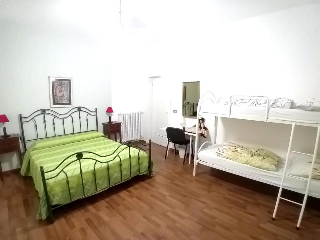 Postel nebo postele na pokoji v ubytování Casa vacanze Aielli Risorgimento