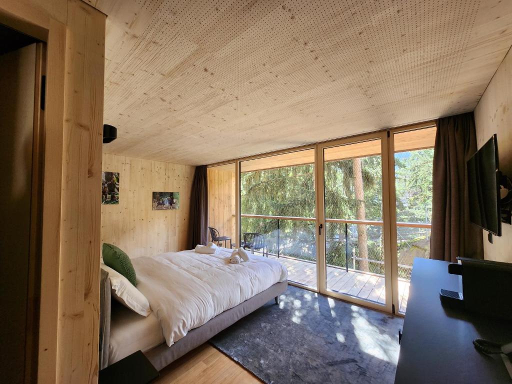 Postel nebo postele na pokoji v ubytování Zoo des Marécottes Boutique Hôtel