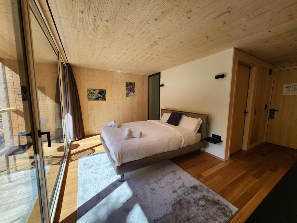 Postel nebo postele na pokoji v ubytování Zoo des Marécottes Boutique Hôtel