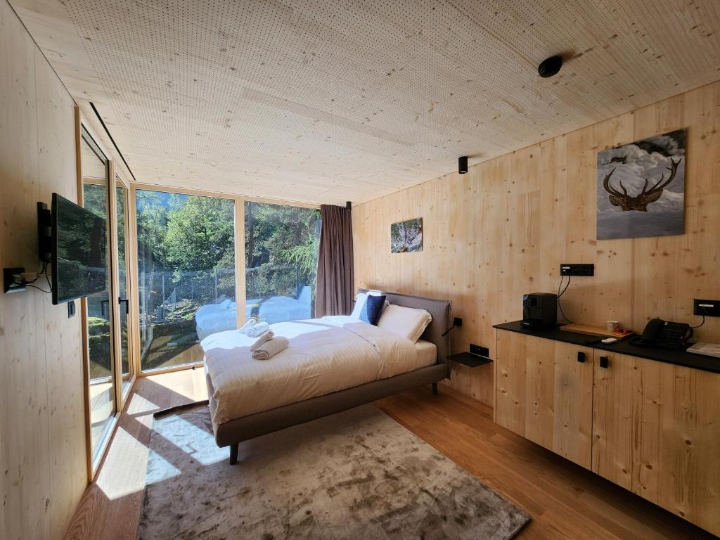 Postel nebo postele na pokoji v ubytování Zoo des Marécottes Boutique Hôtel