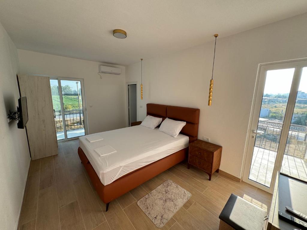 Postel nebo postele na pokoji v ubytování Magda apartments