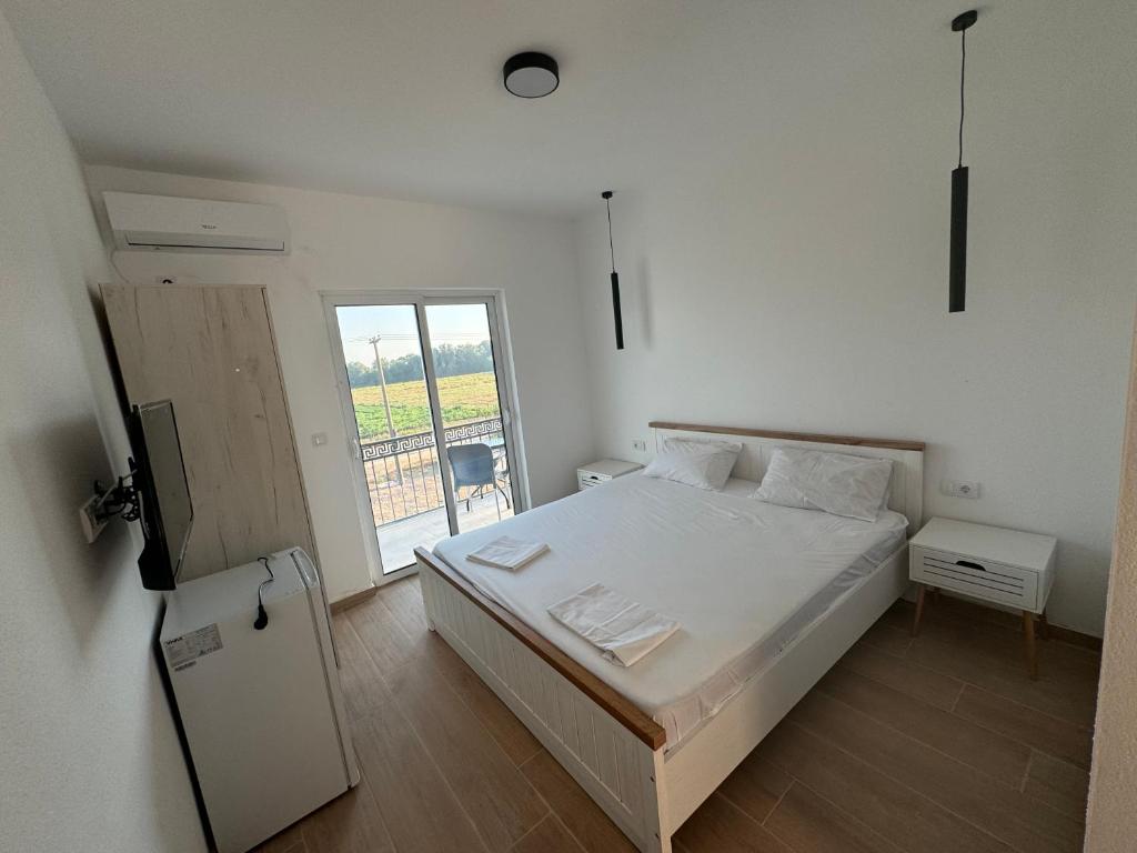 Postel nebo postele na pokoji v ubytování Magda apartments