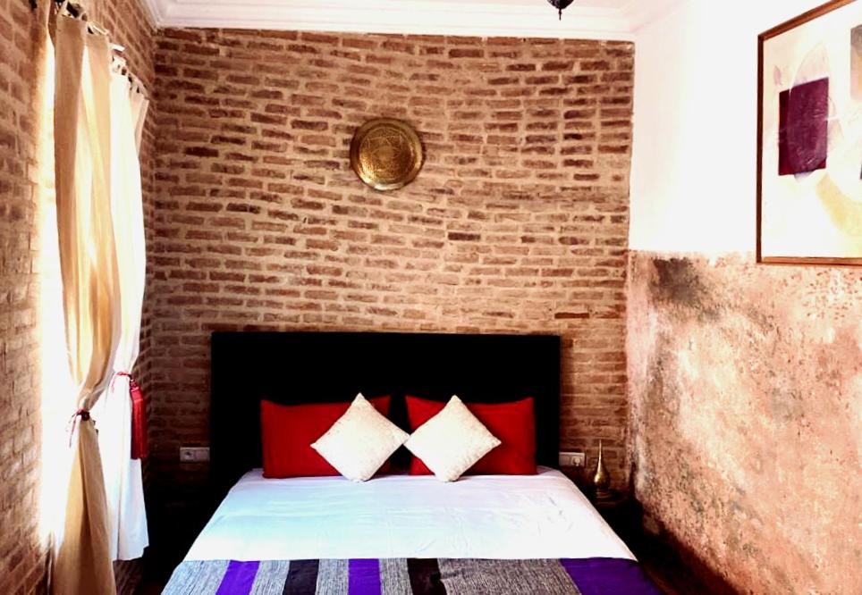 Postel nebo postele na pokoji v ubytování Riad maison Bounouar
