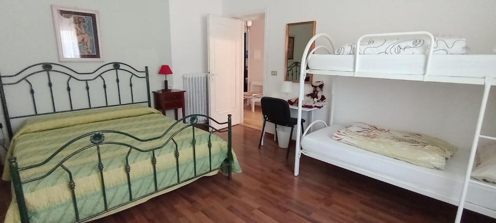 Postel nebo postele na pokoji v ubytování Casa vacanze Aielli Risorgimento