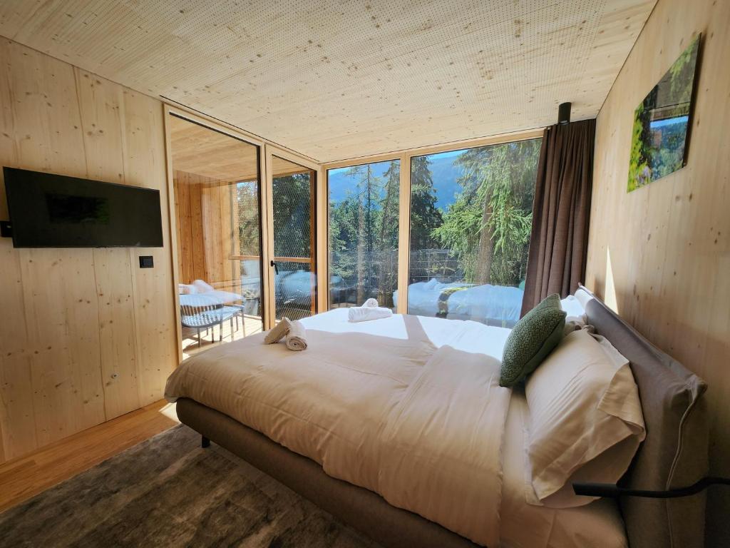 Postel nebo postele na pokoji v ubytování Zoo des Marécottes Boutique Hôtel