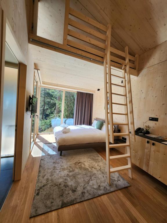 Postel nebo postele na pokoji v ubytování Zoo des Marécottes Boutique Hôtel