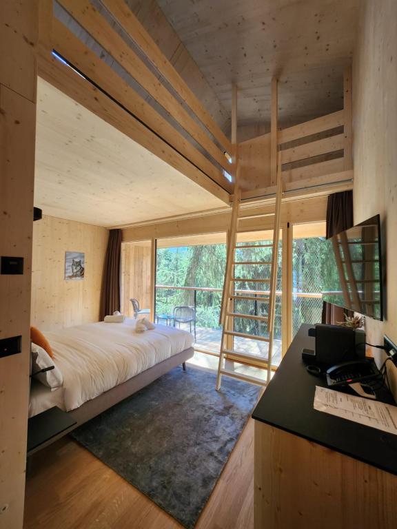 Postel nebo postele na pokoji v ubytování Zoo des Marécottes Boutique Hôtel