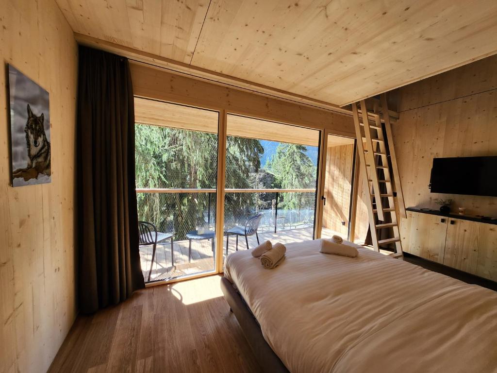 Postel nebo postele na pokoji v ubytování Zoo des Marécottes Boutique Hôtel