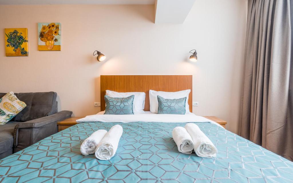 Postel nebo postele na pokoji v ubytování New Gudauri NG Rooms